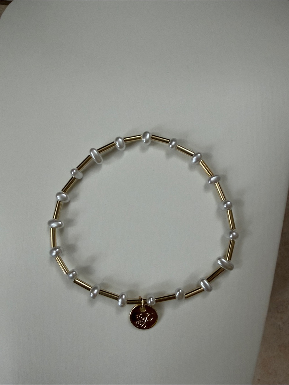Plunder Gold Tone and White Pearl Stretch Bracelet with Logo Charm - Picture 4 of 4